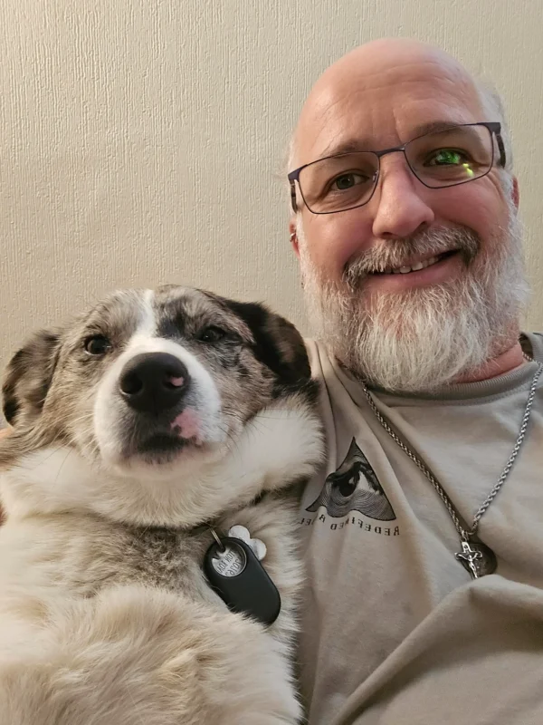 Brendan, therapist and founder of People on Board with is dog